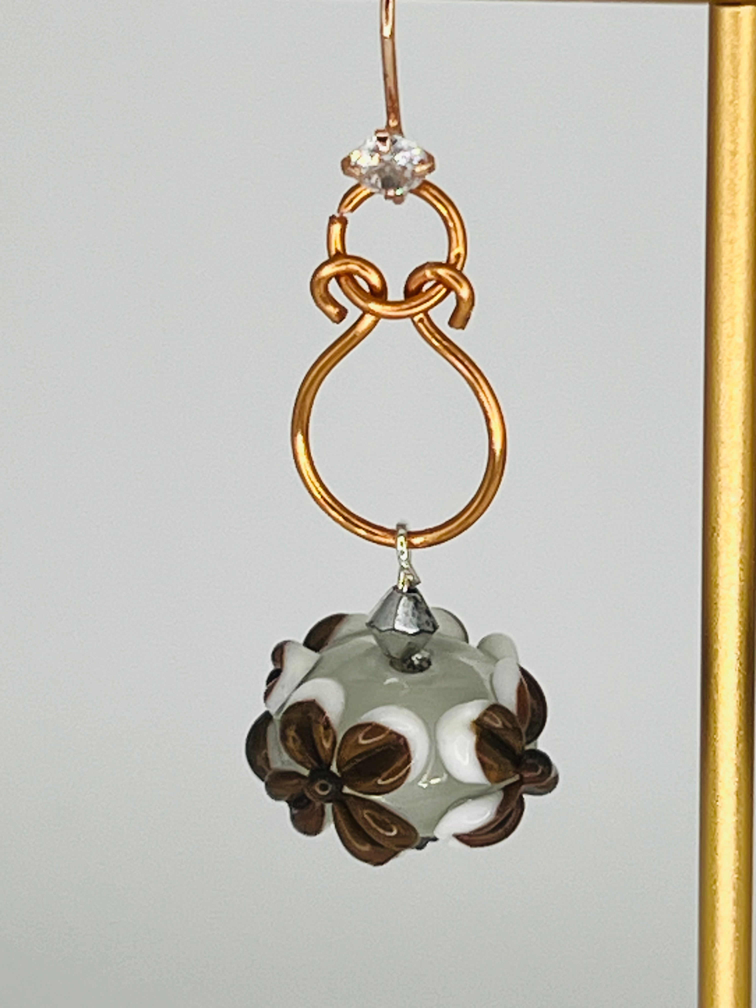 Hand-Shaped Copper Wire Earrings with Brown and White Floral Bead