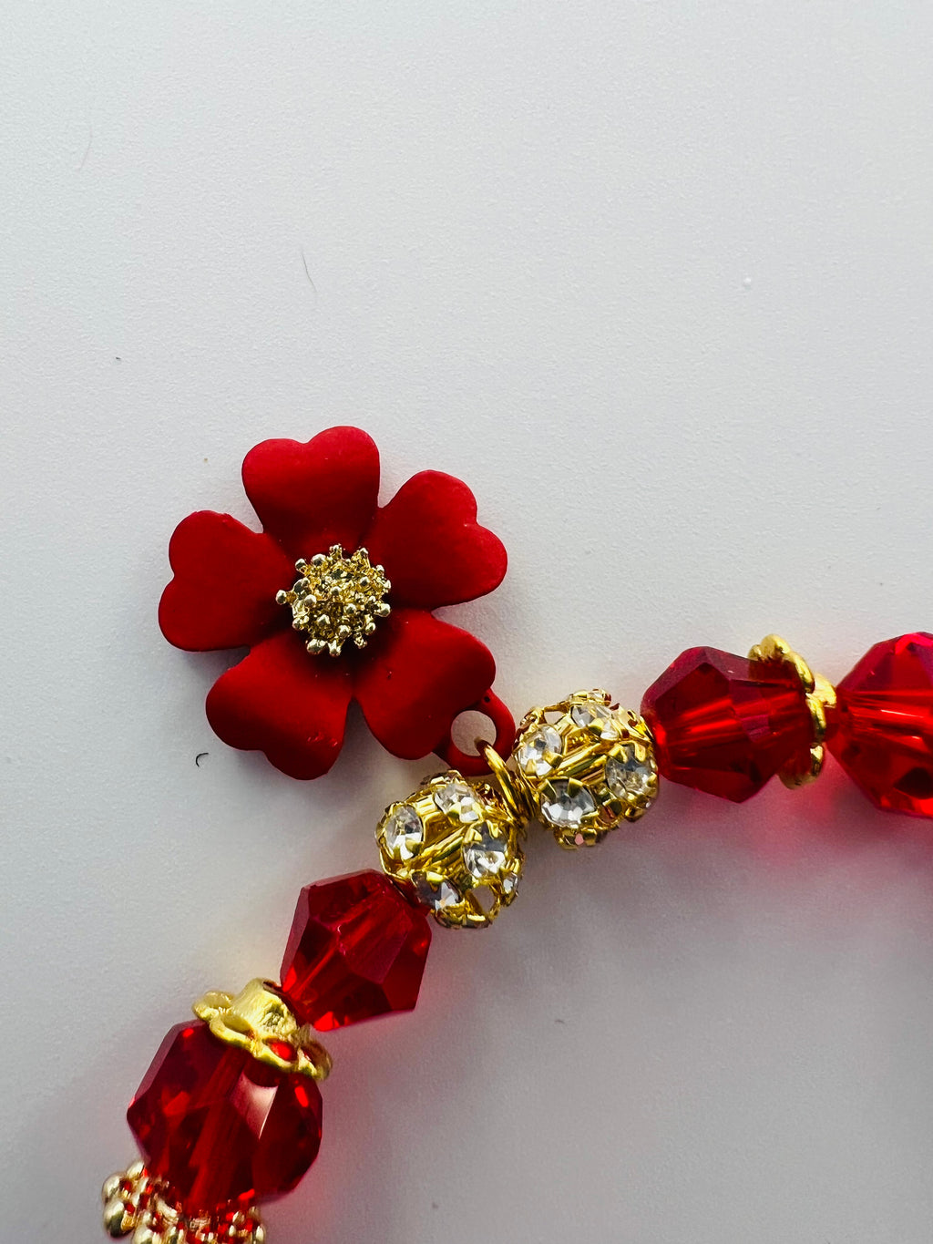 Red Floral Charm Bracelet with Tassel Accent