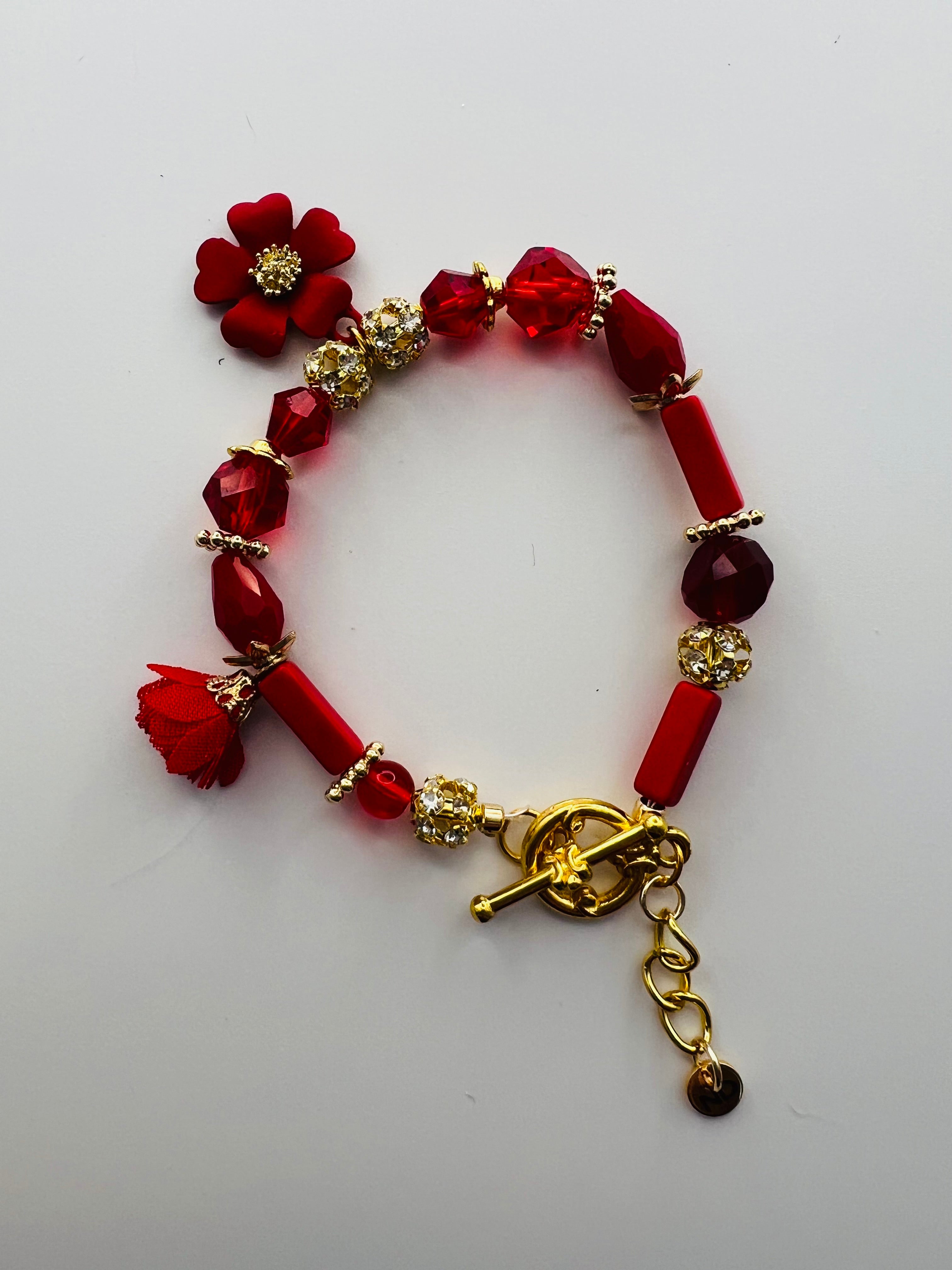 Red Floral Charm Bracelet with Tassel Accent