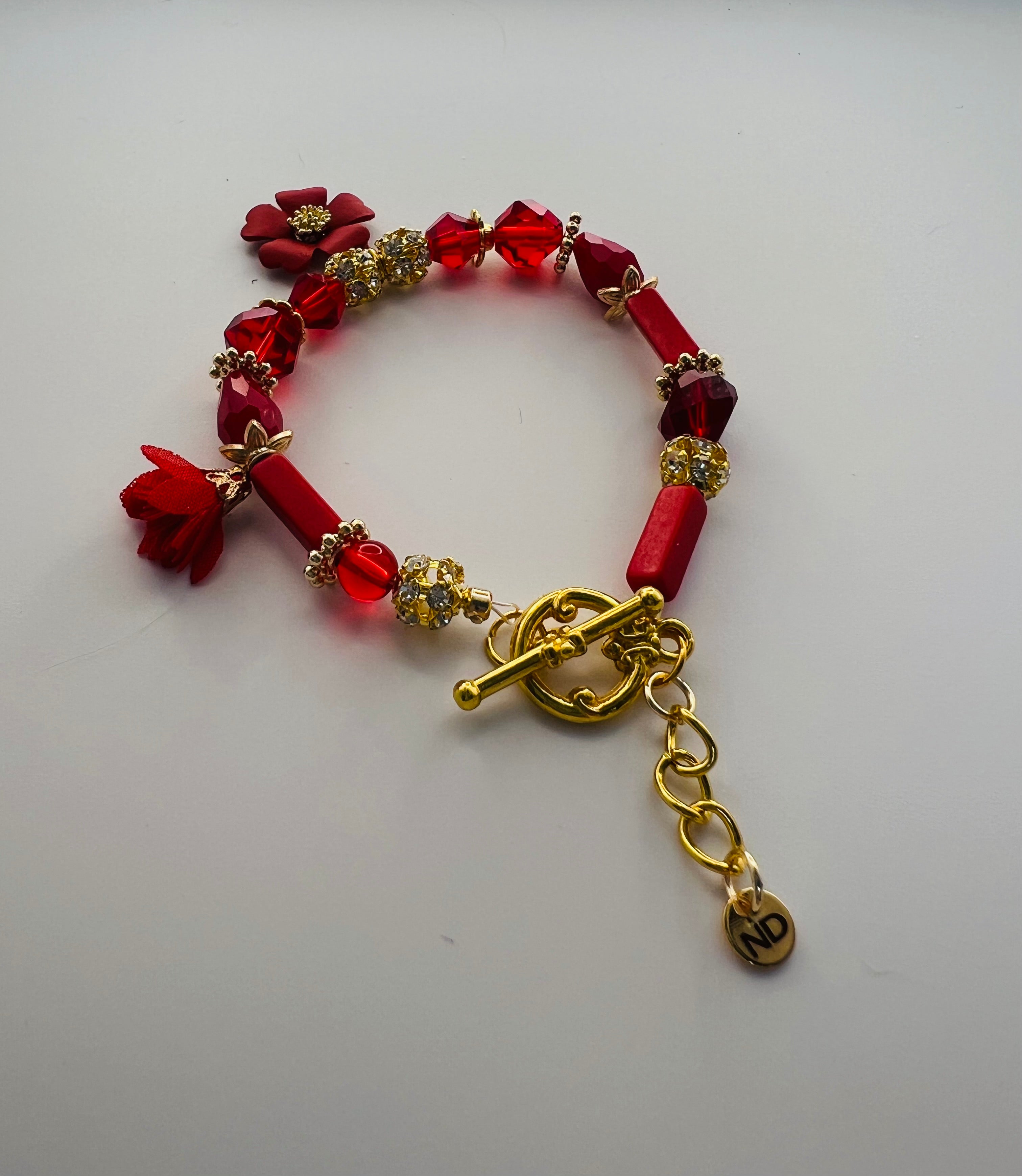 Red Floral Charm Bracelet with Tassel Accent
